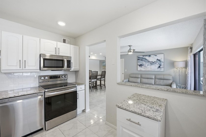 Step into this deluxe, completely renovated model featuring an - photo 21