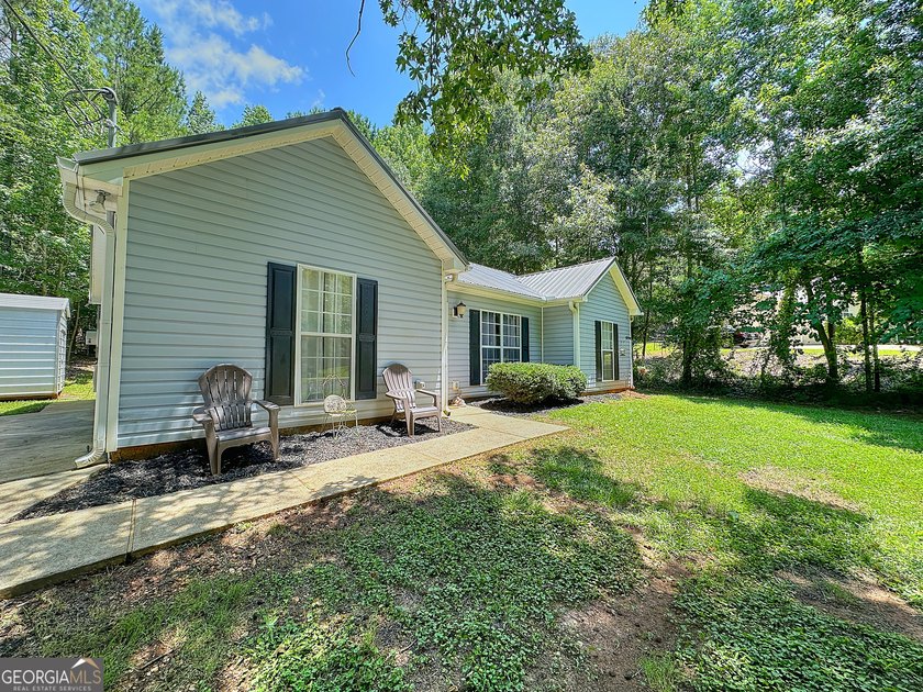 Welcome home to this charming 3-bedroom, 2-bath ranch nestled in - photo 2