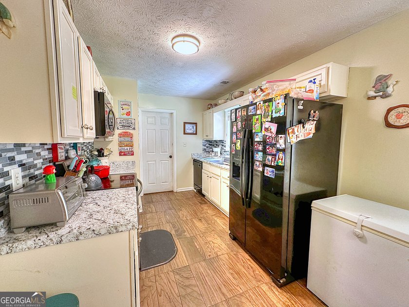 Welcome home to this charming 3-bedroom, 2-bath ranch nestled in - photo 10