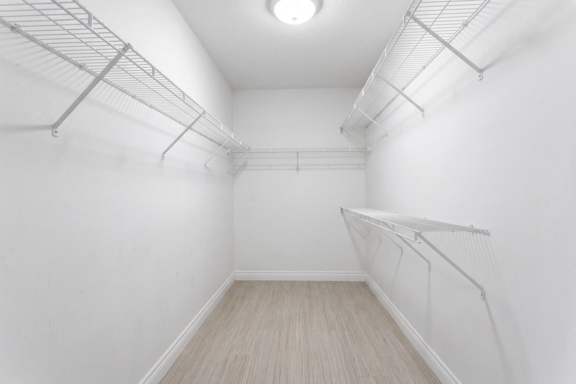 Nestled on a quiet street, this spacious CBS home is designed - photo 12