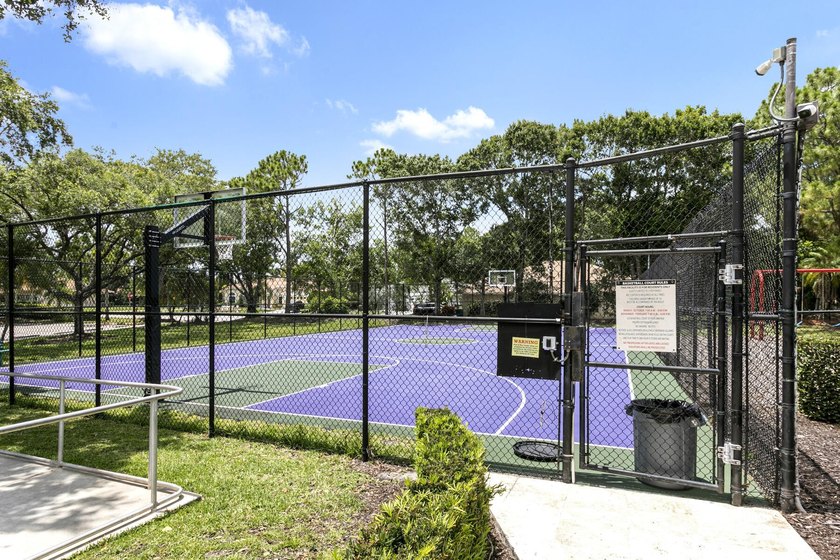 Nestled on a quiet street, this spacious CBS home is designed - photo 23