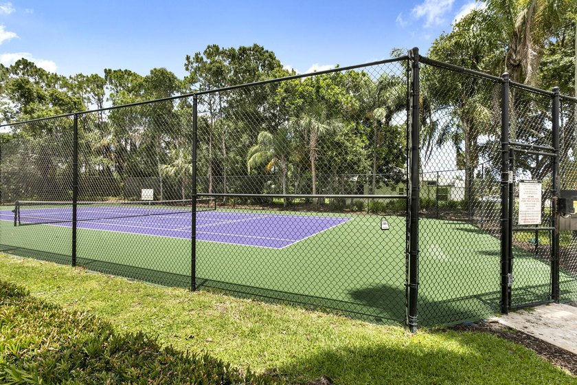 Nestled on a quiet street, this spacious CBS home is designed - photo 26