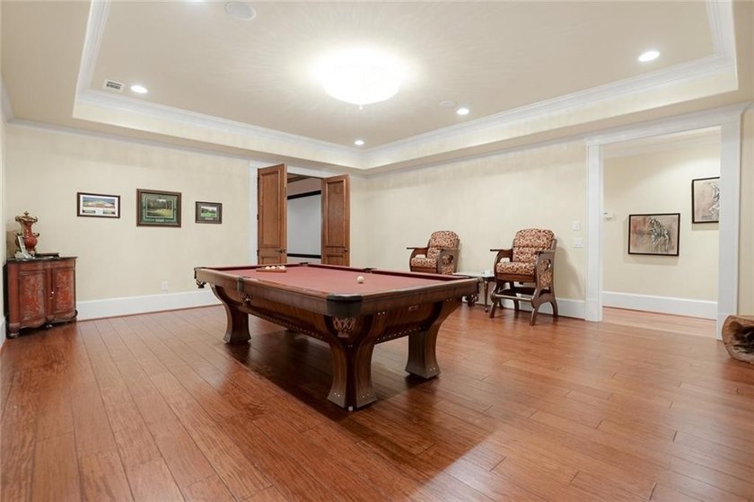 Perfectly positioned within the prestigious gated golf community - photo 36