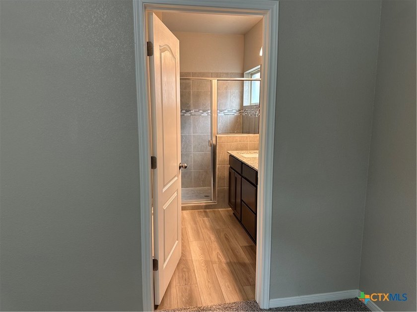 An OMEGA Home in Three Creeks which offers access to the - photo 11