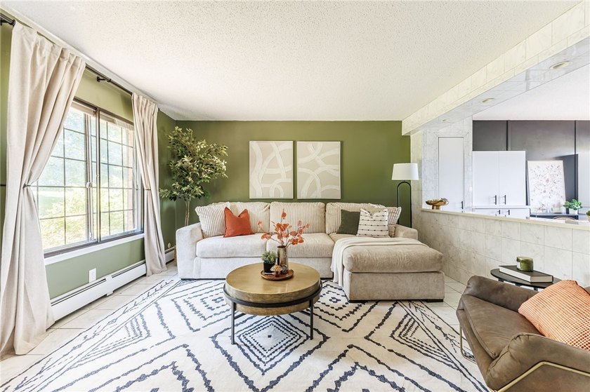 Move-in ready, low-maintenance living awaits! Welcome to 8 - photo 4