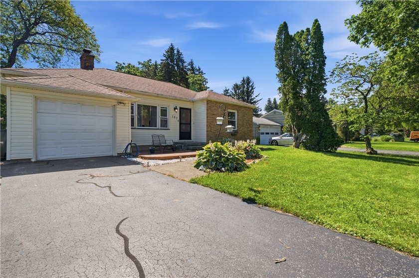 Welcome to 167 Ridgemont Drive! Nestled in a quiet - photo 2