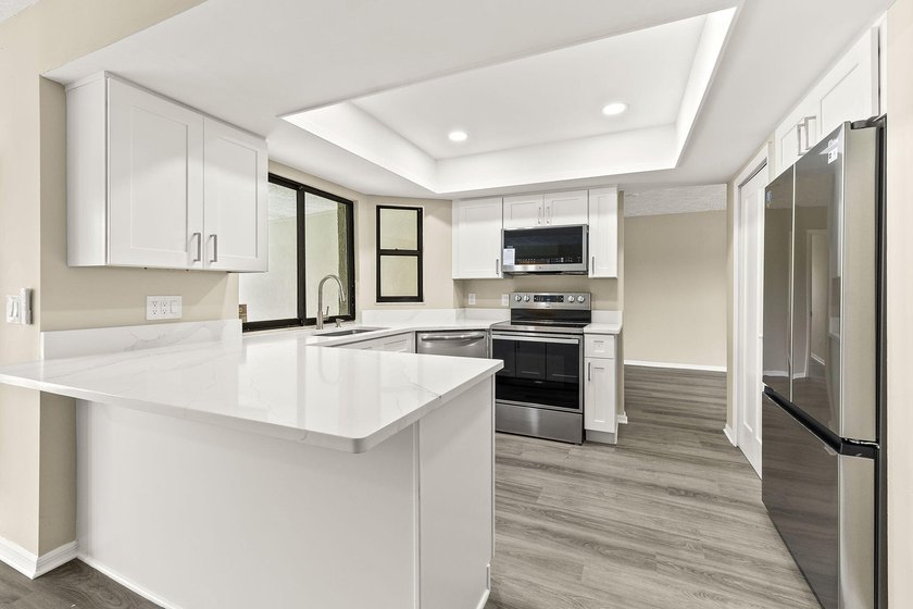 This beautifully remodeled pool home on an over sized lot is - photo 12