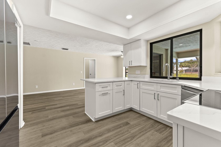 This beautifully remodeled pool home on an over sized lot is - photo 15