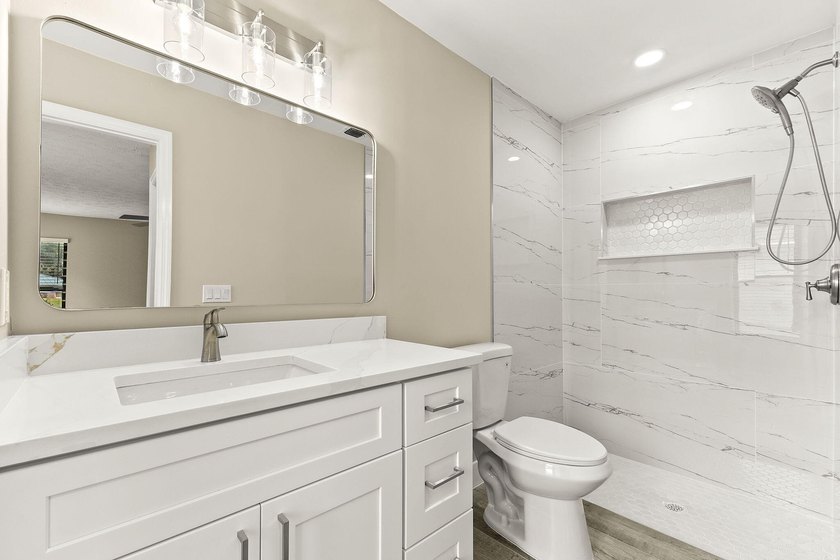 This beautifully remodeled pool home on an over sized lot is - photo 19