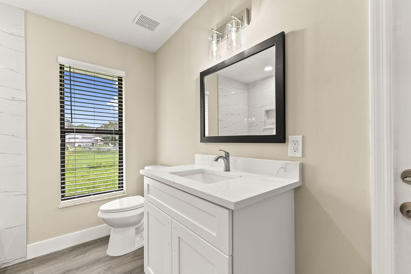 This beautifully remodeled pool home on an over sized lot is - photo 22