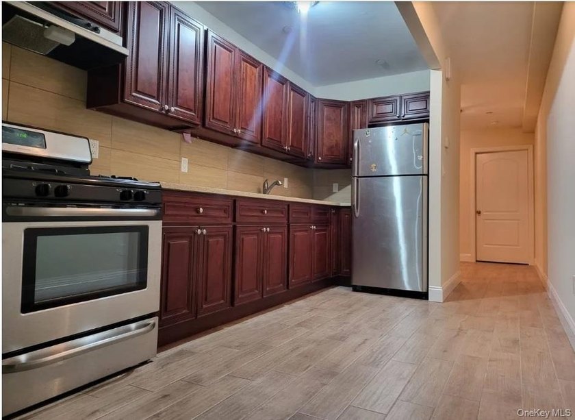 Welcome to 27 Cox Place , a well-maintained, attached brick - photo 2