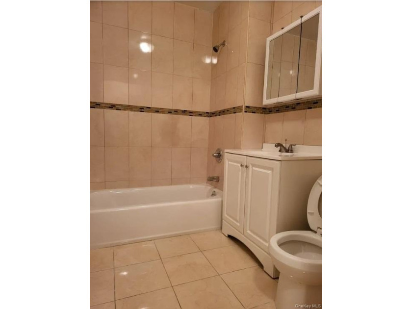 Welcome to 27 Cox Place , a well-maintained, attached brick - photo 4