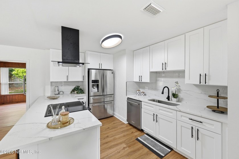 Completely renovated and move-in ready! This beautiful 4-bedroom - photo 14