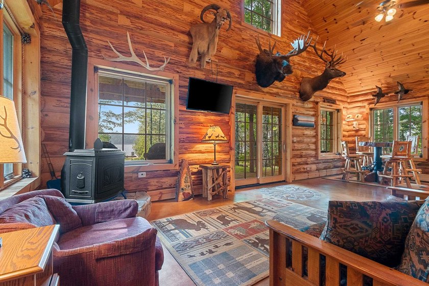 Experience true Northwoods living in this beautiful full log - photo 11