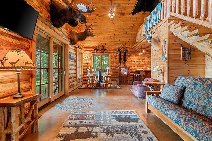 Experience true Northwoods living in this beautiful full log - photo 13