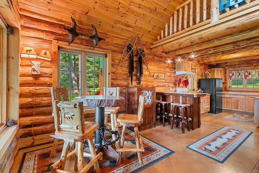 Experience true Northwoods living in this beautiful full log - photo 17