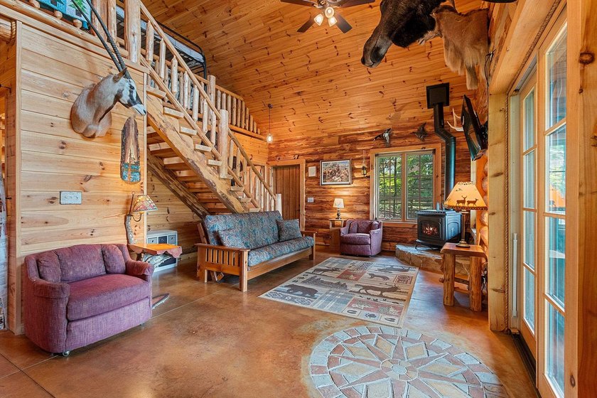 Experience true Northwoods living in this beautiful full log - photo 20