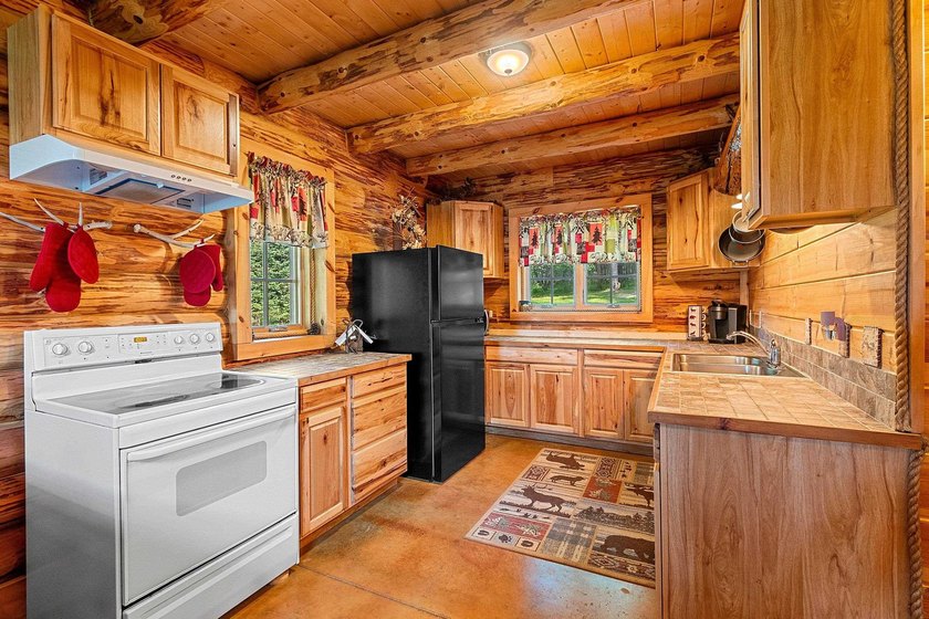 Experience true Northwoods living in this beautiful full log - photo 22