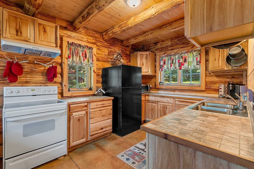 Experience true Northwoods living in this beautiful full log - photo 23