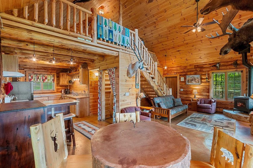 Experience true Northwoods living in this beautiful full log - photo 24