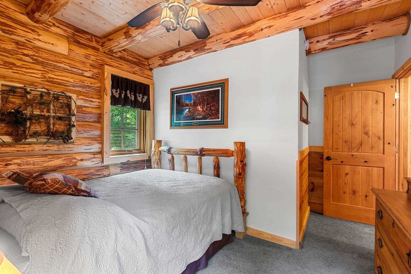 Experience true Northwoods living in this beautiful full log - photo 25