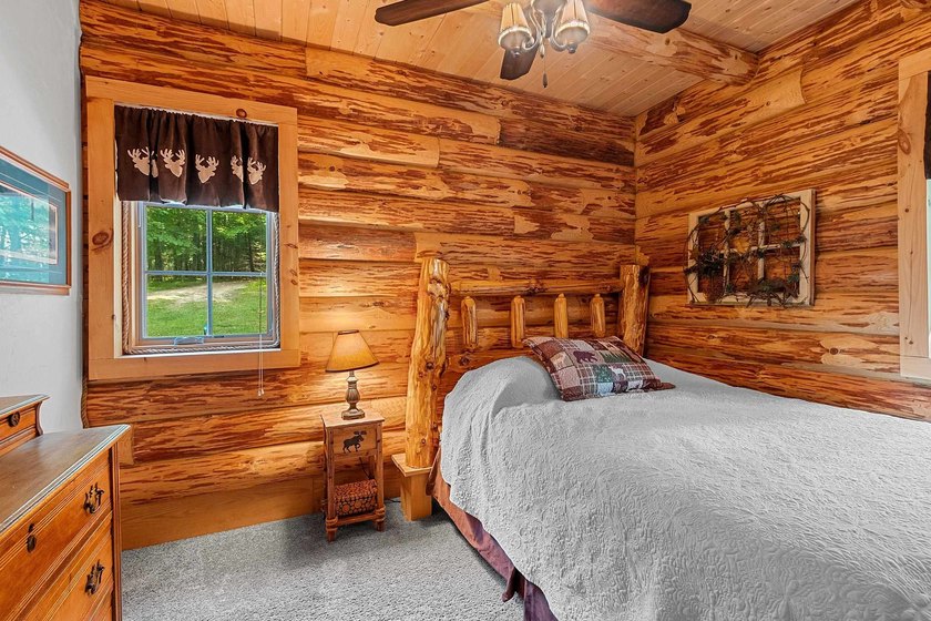 Experience true Northwoods living in this beautiful full log - photo 26
