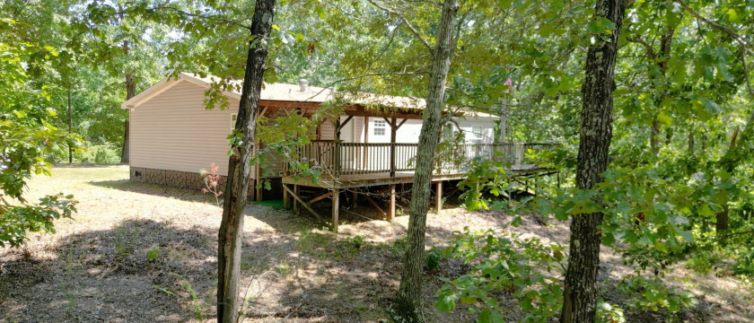 Home with 3.2 acres near lake with 3 campsites. - photo 3