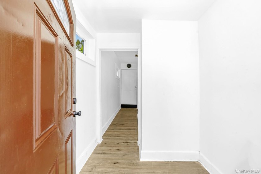 Beautifully renovated legal two-family home offering updates - photo 3