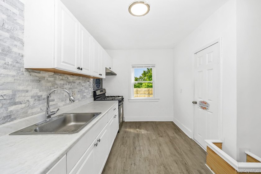 Beautifully renovated legal two-family home offering updates - photo 7