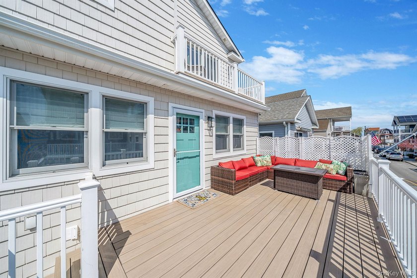 Just over one block from the beach, this fully renovated home - photo 3
