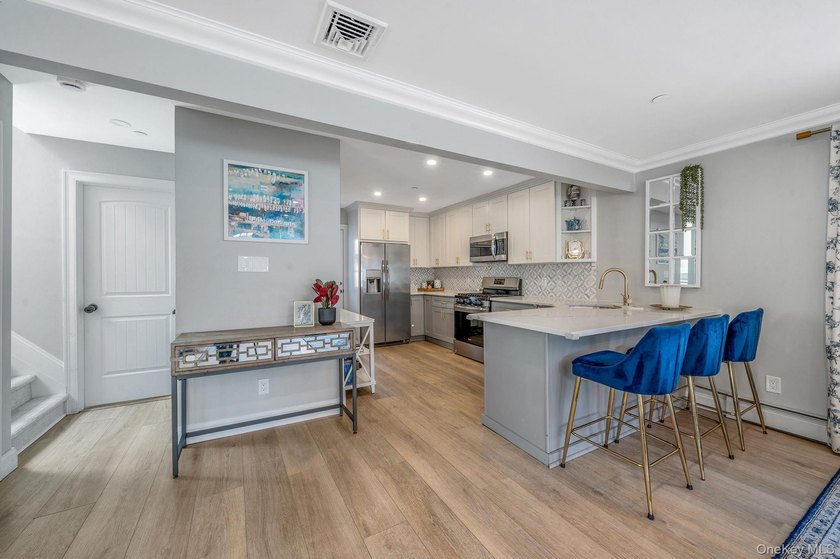 Just over one block from the beach, this fully renovated home - photo 8