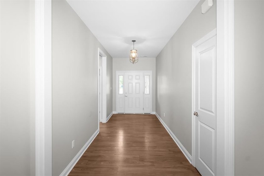 Welcome to Woodland Ridge! Built in 2022, this thoughtfully - photo 3