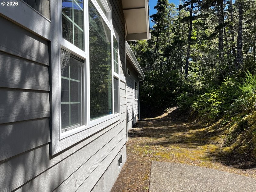 Nestled in a peaceful wooded setting within the desirable Heceta - photo 38