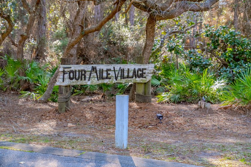 PRICE REDUCED !!Upon entering the gates of Four Mile Village you - photo 2