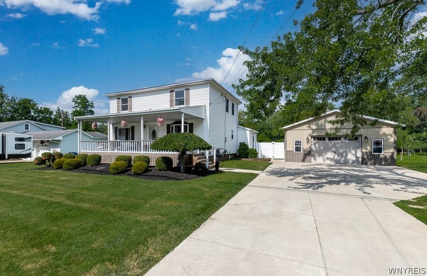 Welcome home to 212 East Ave! This inviting two-story home sits - photo 2