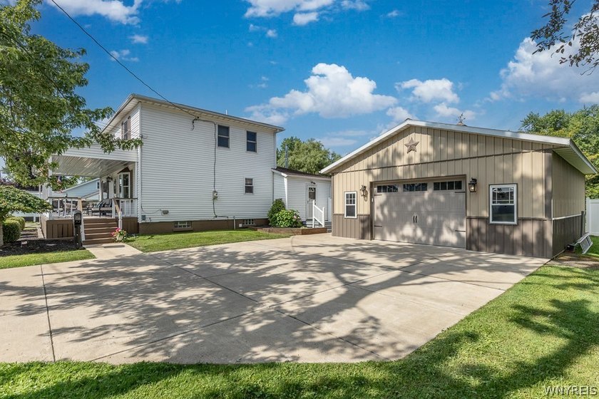 Welcome home to 212 East Ave! This inviting two-story home sits - photo 3