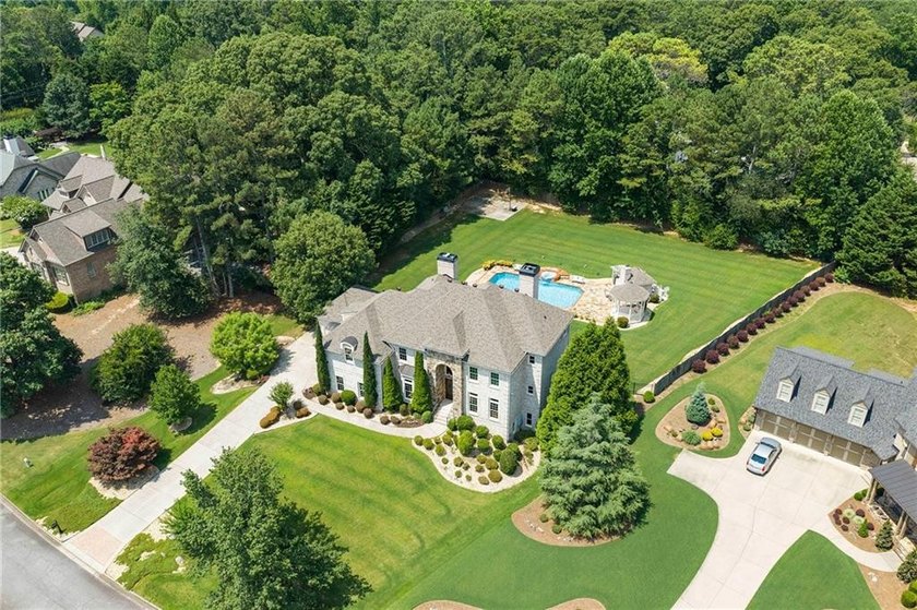 Situated on 1.2+/- private acres within Milton's gated Roxbury - photo 2