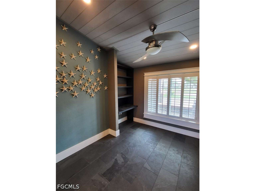 Experience refined Naples living in this beautifully updated - photo 13