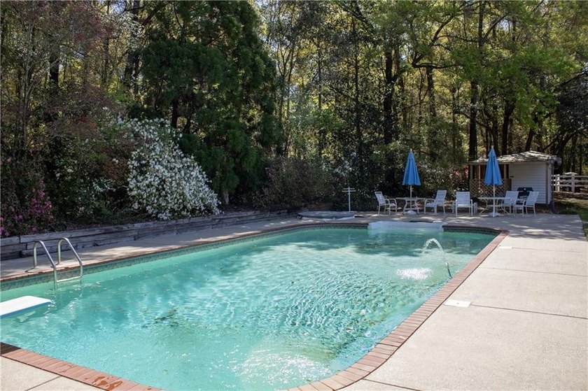 Stately southern elegance situated on a lush 2.6 acre wooded lot - photo 37