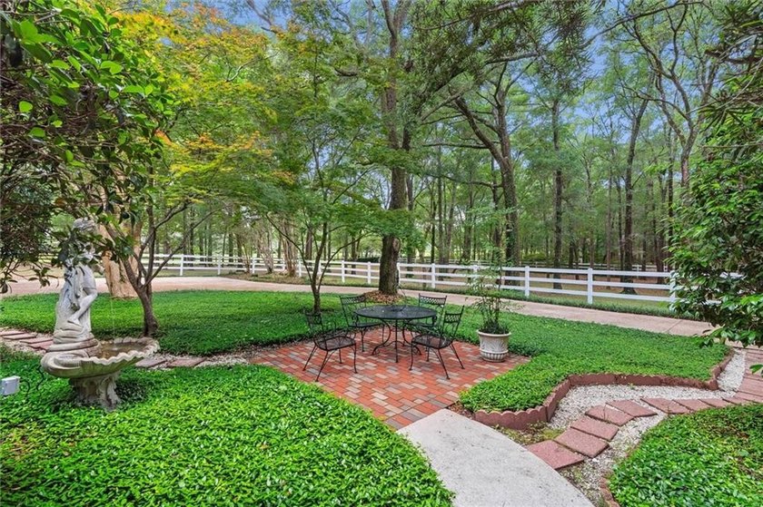 Stately southern elegance situated on a lush 2.6 acre wooded lot - photo 38