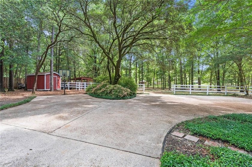 Stately southern elegance situated on a lush 2.6 acre wooded lot - photo 39