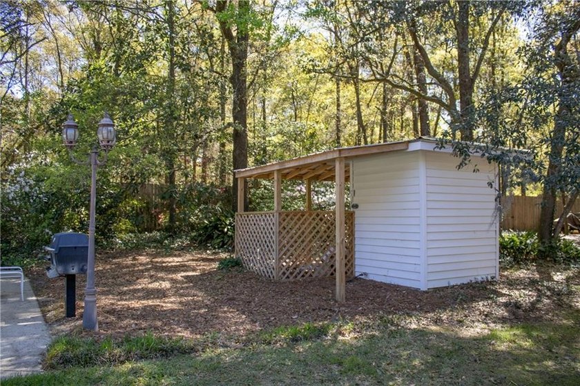 Stately southern elegance situated on a lush 2.6 acre wooded lot - photo 40
