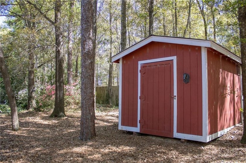 Stately southern elegance situated on a lush 2.6 acre wooded lot - photo 41