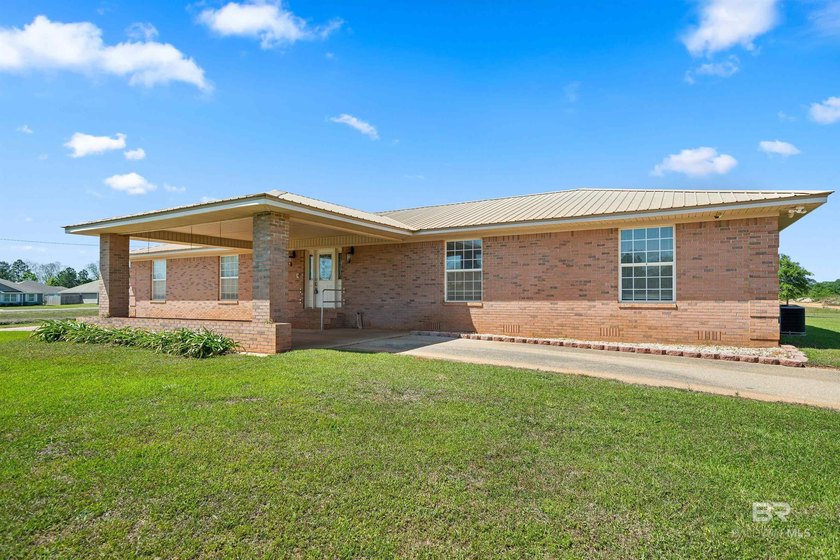 Located in a rural setting in Foley, 17635 Charolais Rd offers - photo 3