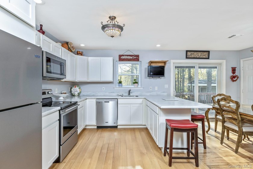 Welcome to this 3-bedroom, 2 bath ranch set on a shy acre (92) - photo 8