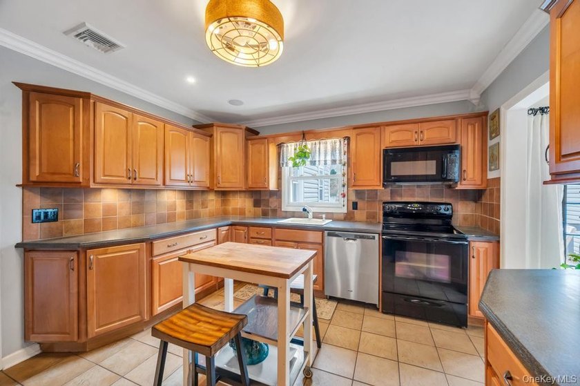 Welcome to this charming, well-maintained home featuring a - photo 12