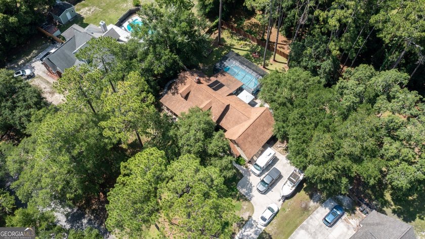 RELAX POOLSIDE IN YOUR OWN PRIVATE BACKYARD OASIS! This - photo 3