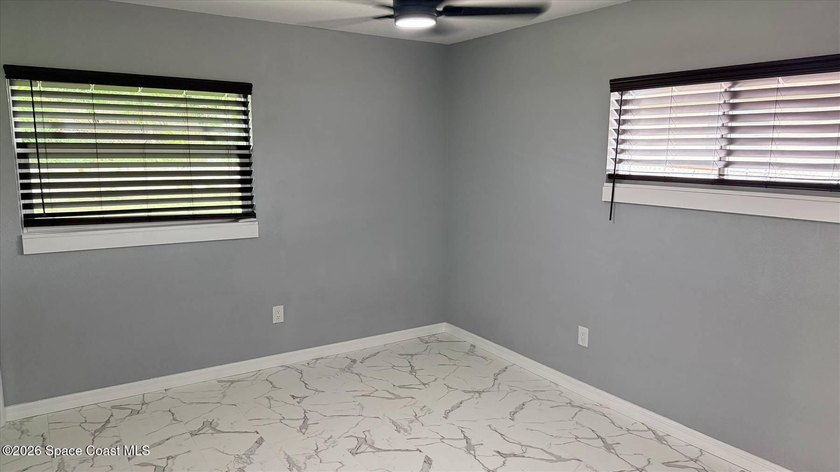 Beautifully remodeled concrete block 4/2 home with a new metal - photo 12