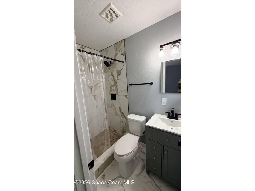 Beautifully remodeled concrete block 4/2 home with a new metal - photo 13
