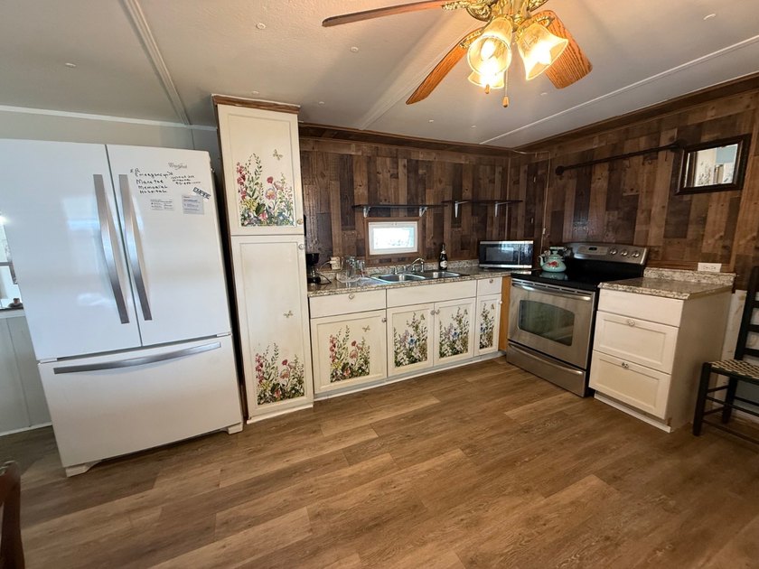 55+ Community. LOW LOT RENT: $688 a month. Includes water, sewer - photo 9